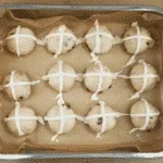 It's Easter so hot cross buns are on the menu!! What a joyous moment. Homemade hot cross buns. Simple to make and so delicious. Yum! Yum! | theyumyumclub.com