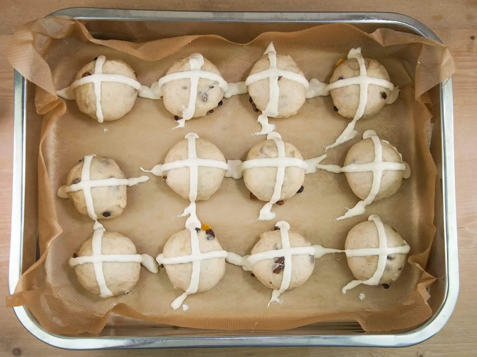 It's Easter so hot cross buns are on the menu!! What a joyous moment. Homemade hot cross buns. Simple to make and so delicious. Yum! Yum! | theyumyumclub.com