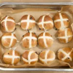 It's Easter so hot cross buns are on the menu!! What a joyous moment. Homemade hot cross buns. Simple to make and so delicious. Yum! Yum! | theyumyumclub.com