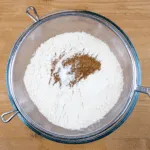 It's Easter so hot cross buns are on the menu!! What a joyous moment. Homemade hot cross buns. Simple to make and so delicious. Yum! Yum! | theyumyumclub.com
