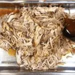 We all know pulled pork nachos but how about tangy pulled pork shoulder Doritos! Tangy cheese Doritos covered in spicy slow-cooked pork shoulder drowned in melted cheddar cheese. Yum! | theyumyumclub.com