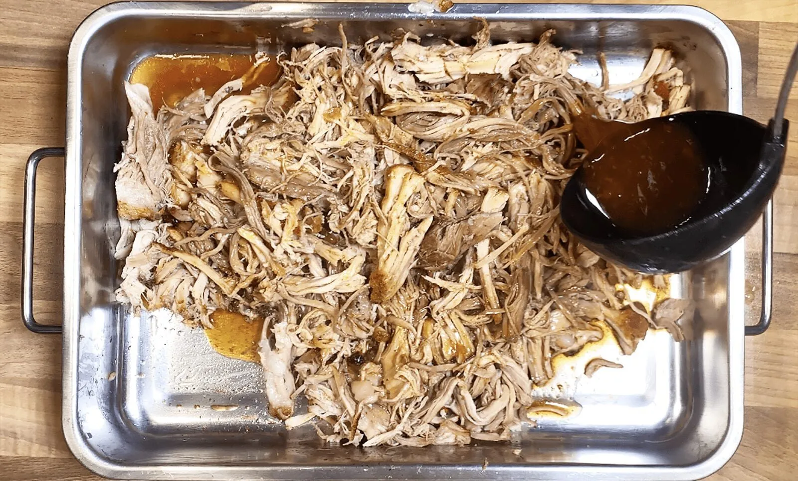 We all know pulled pork nachos but how about tangy pulled pork shoulder Doritos! Tangy cheese Doritos covered in spicy slow-cooked pork shoulder drowned in melted cheddar cheese. Yum! | theyumyumclub.com