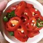 We all know pulled pork nachos but how about tangy pulled pork shoulder Doritos! Tangy cheese Doritos covered in spicy slow-cooked pork shoulder drowned in melted cheddar cheese. Yum! | theyumyumclub.com