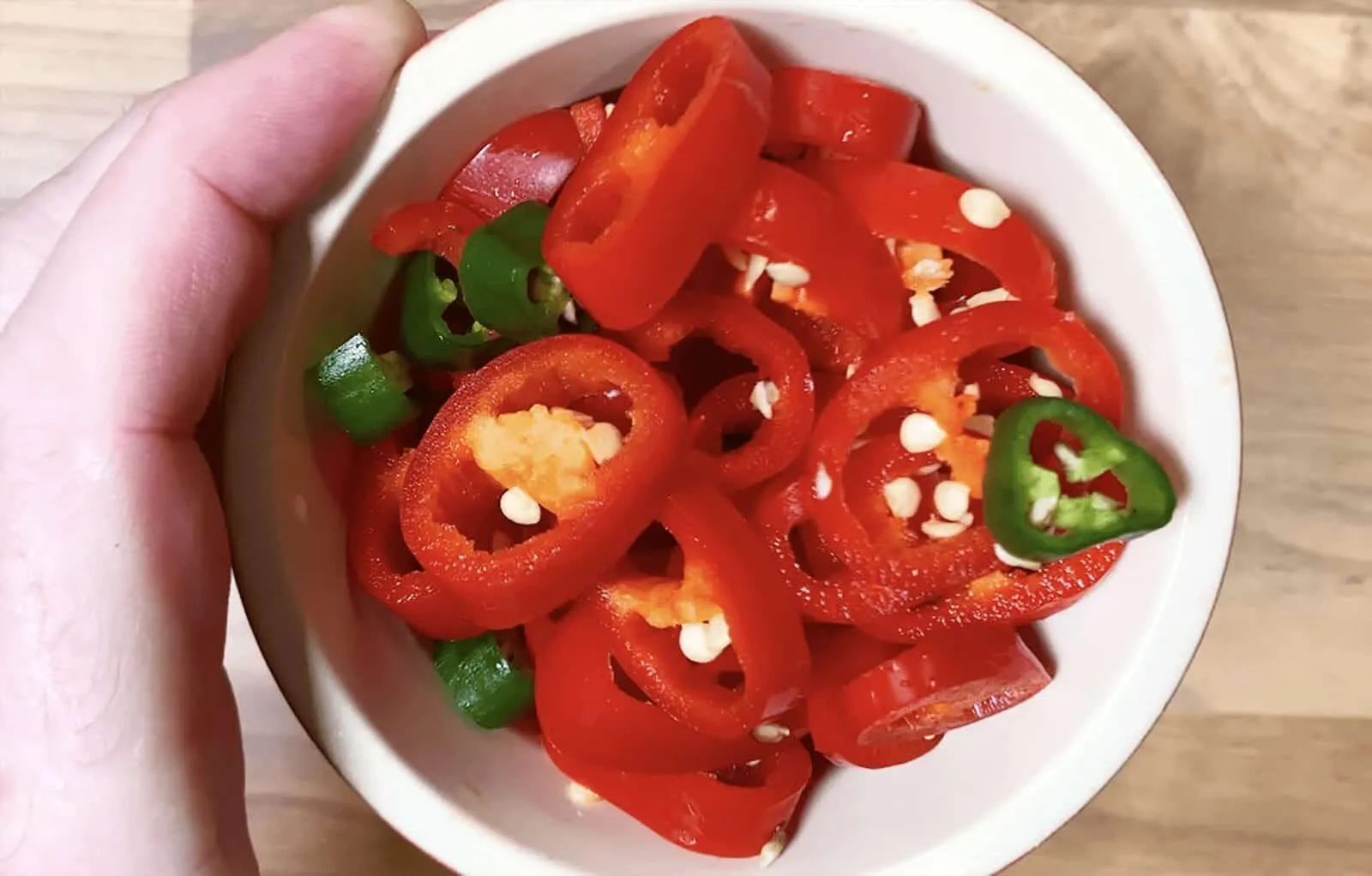 We all know pulled pork nachos but how about tangy pulled pork shoulder Doritos! Tangy cheese Doritos covered in spicy slow-cooked pork shoulder drowned in melted cheddar cheese. Yum! | theyumyumclub.com