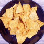 We all know pulled pork nachos but how about tangy pulled pork shoulder Doritos! Tangy cheese Doritos covered in spicy slow-cooked pork shoulder drowned in melted cheddar cheese. Yum! | theyumyumclub.com