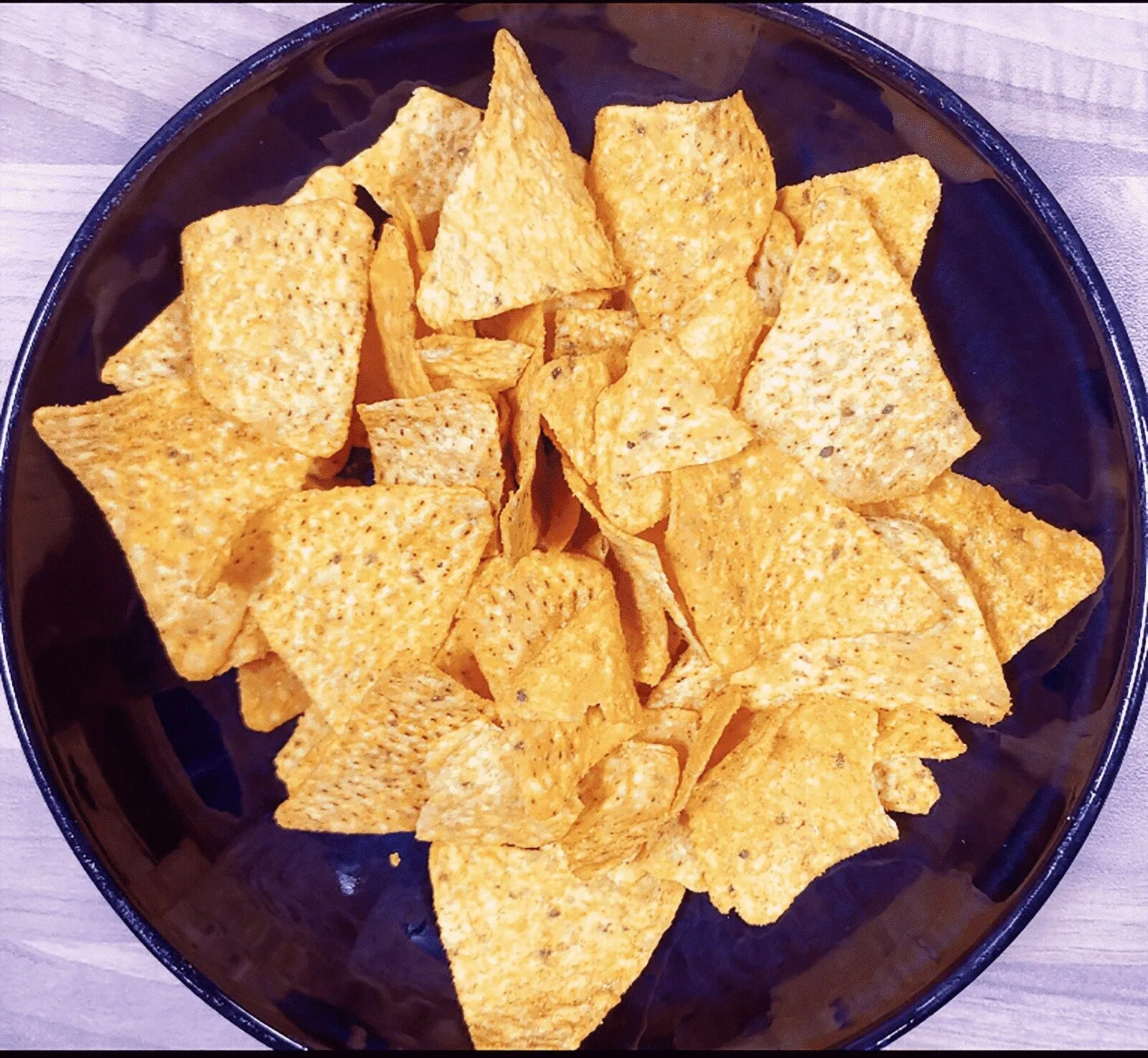 We all know pulled pork nachos but how about tangy pulled pork shoulder Doritos! Tangy cheese Doritos covered in spicy slow-cooked pork shoulder drowned in melted cheddar cheese. Yum! | theyumyumclub.com