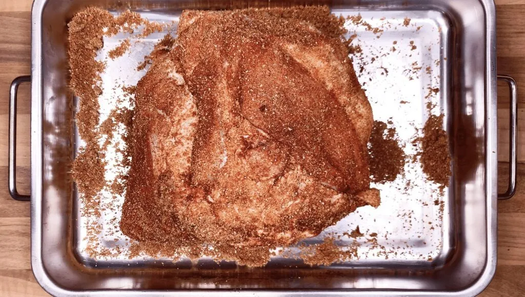 We all know pulled pork nachos but how about tangy pulled pork shoulder Doritos! Tangy cheese Doritos covered in spicy slow-cooked pork shoulder drowned in melted cheddar cheese. Yum! | theyumyumclub.com