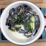Linguine with mussels, scallops and garlic in white wine and cream is a classic Italian recipe. Serve with fresh crusty bread for dipping. Yum! | theyumyumclub.com
