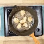 Linguine with mussels, scallops and garlic in white wine and cream is a classic Italian recipe. Serve with fresh crusty bread for dipping. Yum! | theyumyumclub.com