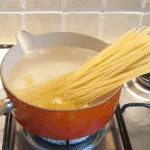 Linguine with mussels, scallops and garlic in white wine and cream is a classic Italian recipe. Serve with fresh crusty bread for dipping. Yum! | theyumyumclub.com