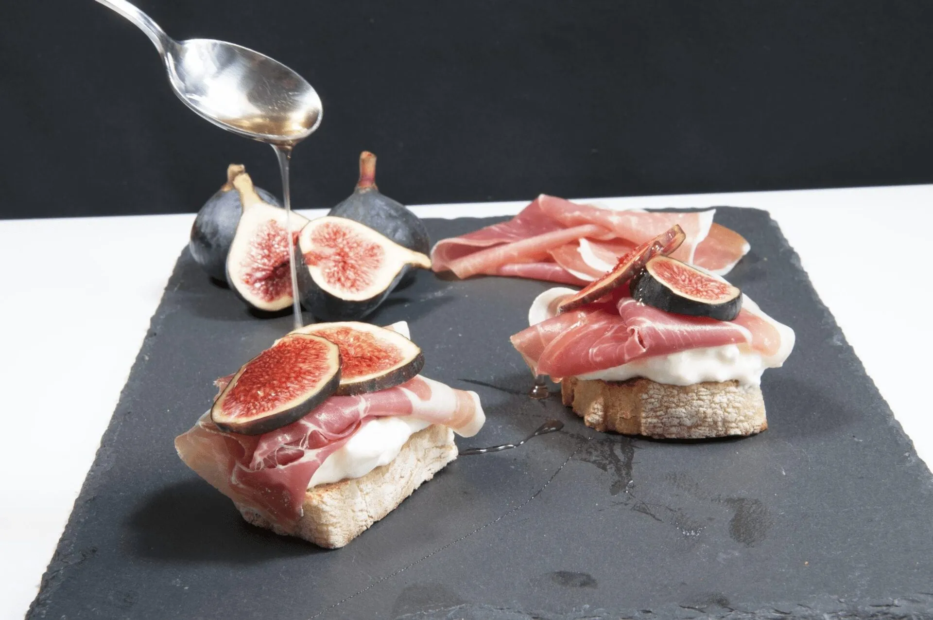 Drizzle honey over the figs https://theyumyumclub.com/2019/04/23/ricotta-prosciutto-fig-crostini/