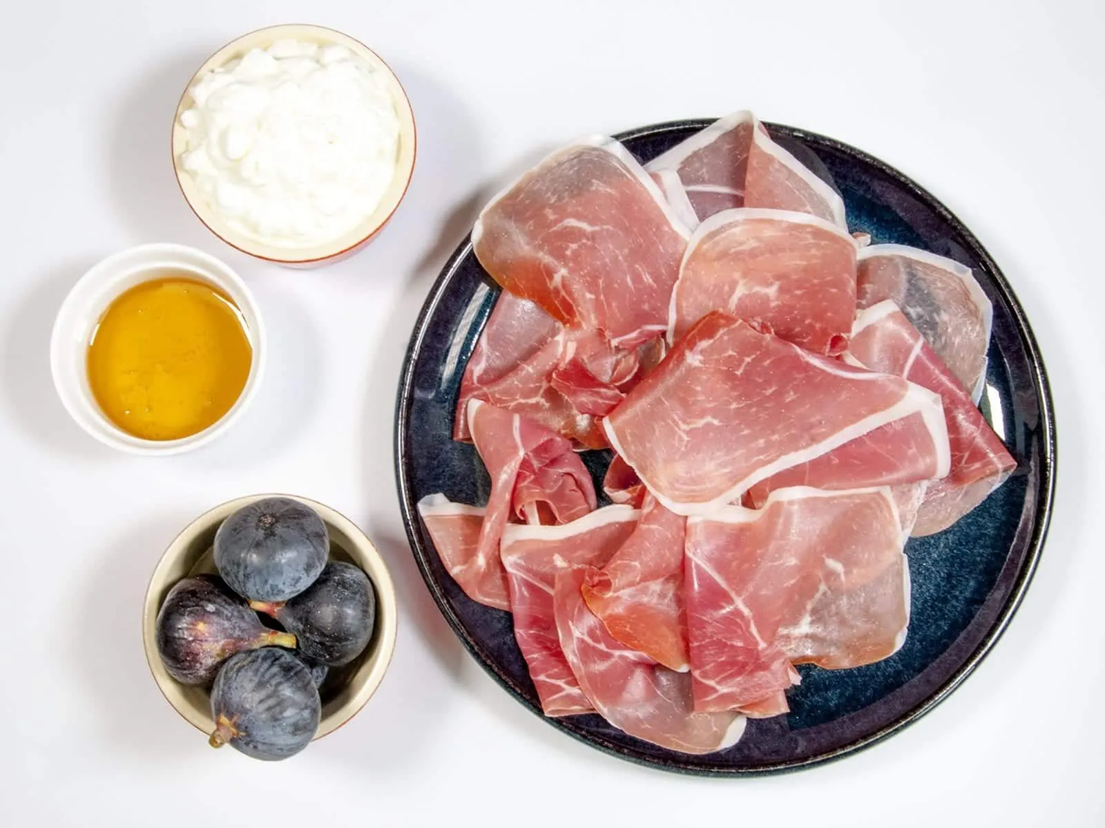 Gather the ingredients for the crostini | https://theyumyumclub.com/2019/04/23/ricotta-prosciutto-fig-crostini/
