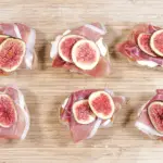 Add the figs to the prosciutto | https://theyumyumclub.com/2019/04/23/ricotta-prosciutto-fig-crostini/