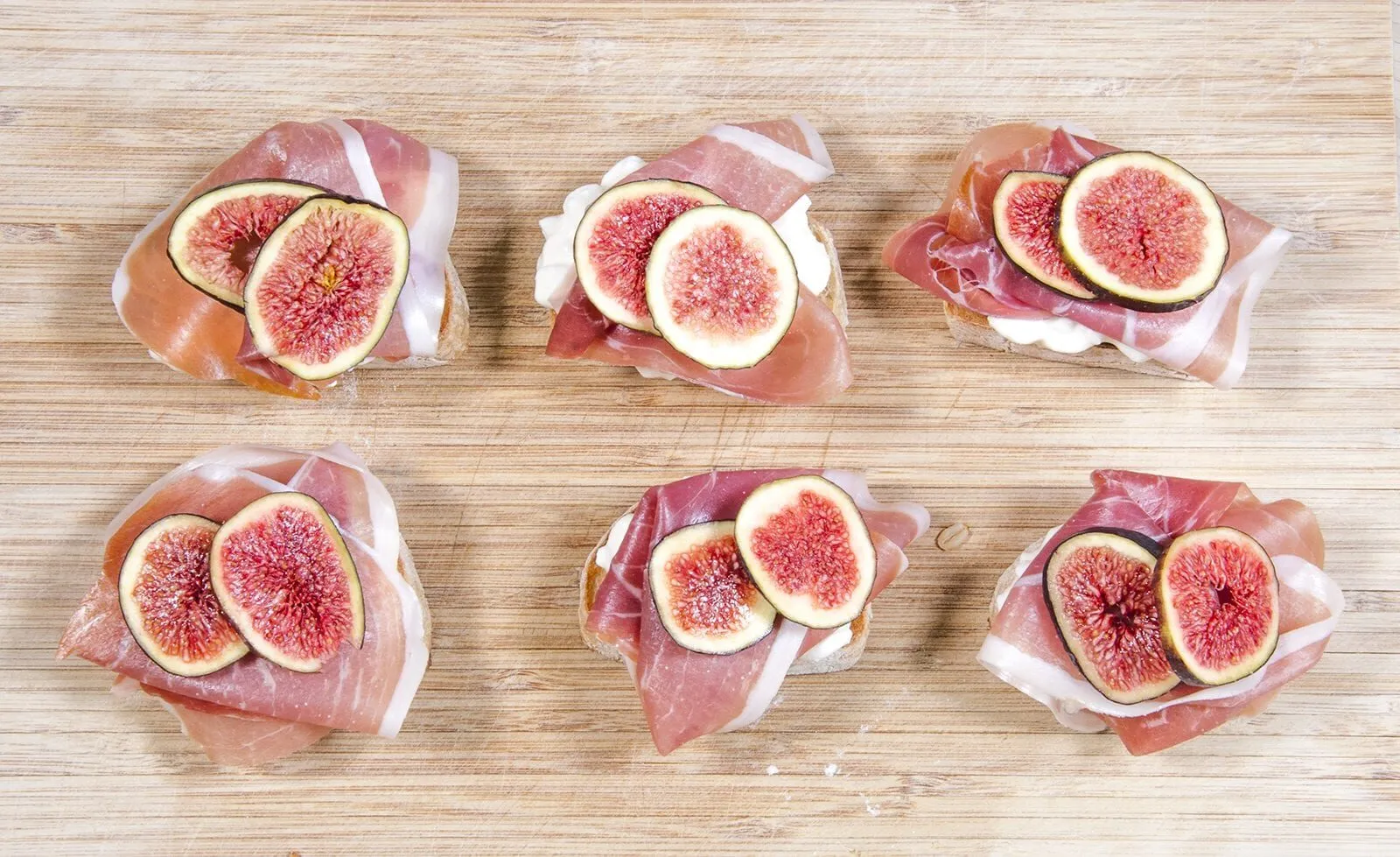 Add the figs to the prosciutto | https://theyumyumclub.com/2019/04/23/ricotta-prosciutto-fig-crostini/