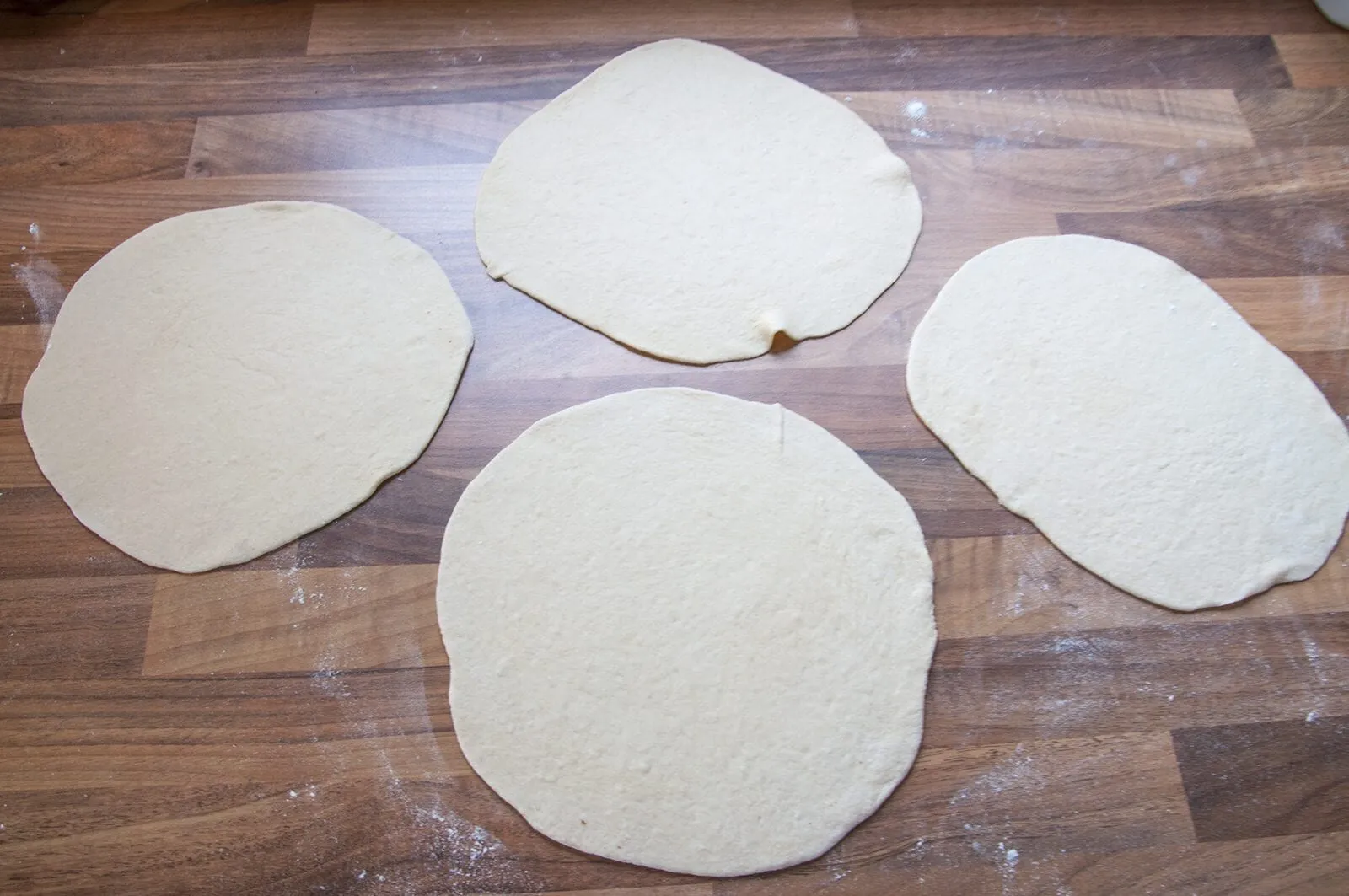 Aromatic Barbecue Chicken Gyros. Roll the pitta dough as thin as possible | https://theyumyumclub.com/2019/04/24/aromatic-barbecue-chicken-gyros/