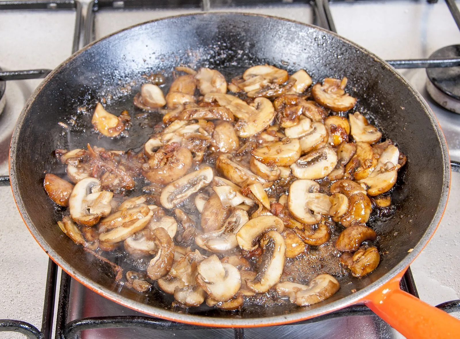 Creamy sherry and thyme chicken thighs. A wonderfully mouthwatering and delicious recipe. Add in wild mushrooms and you have one very special dish. Yum! | theyumyumclub.com