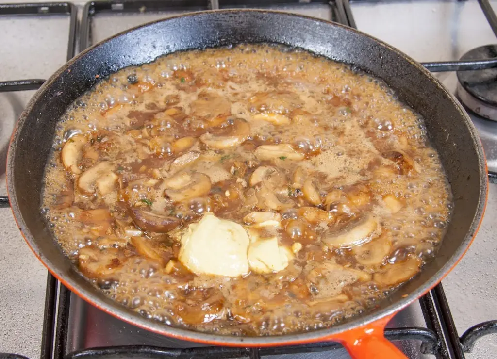 Creamy sherry and thyme chicken thighs. A wonderfully mouthwatering and delicious recipe. Add in wild mushrooms and you have one very special dish. Yum! | theyumyumclub.com