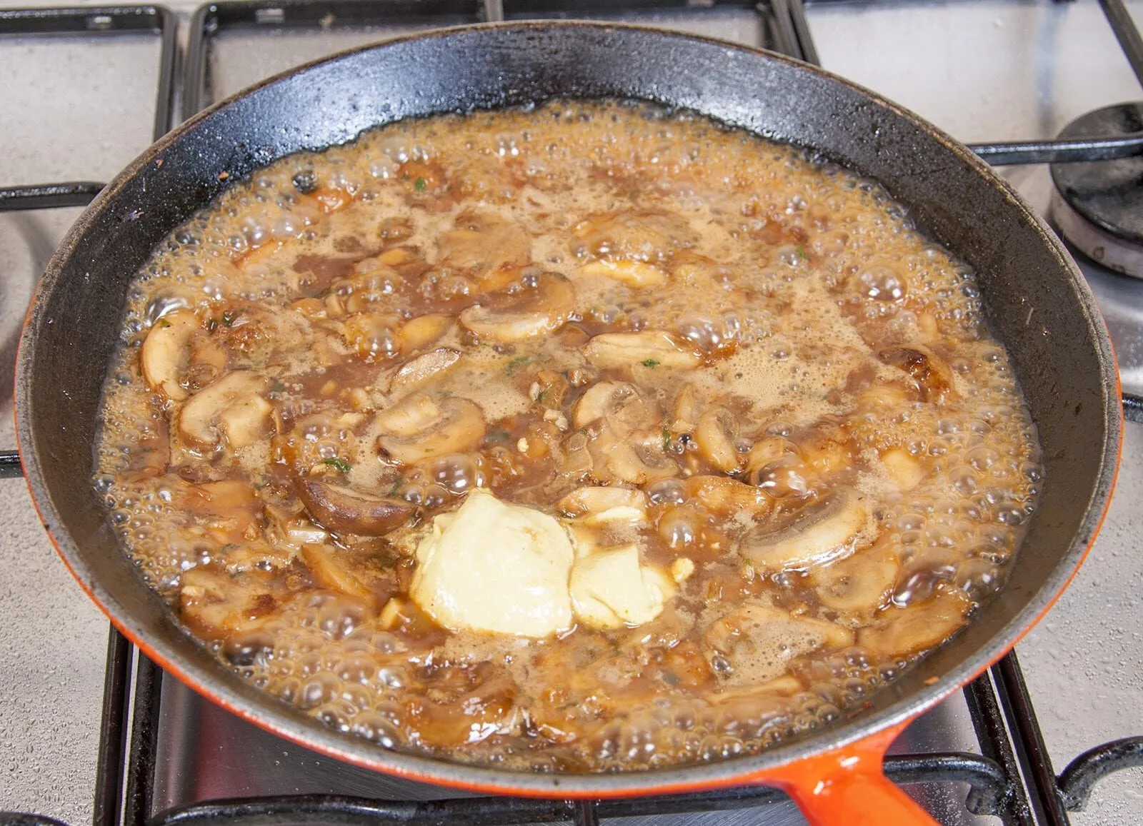 Creamy sherry and thyme chicken thighs. A wonderfully mouthwatering and delicious recipe. Add in wild mushrooms and you have one very special dish. Yum! | theyumyumclub.com