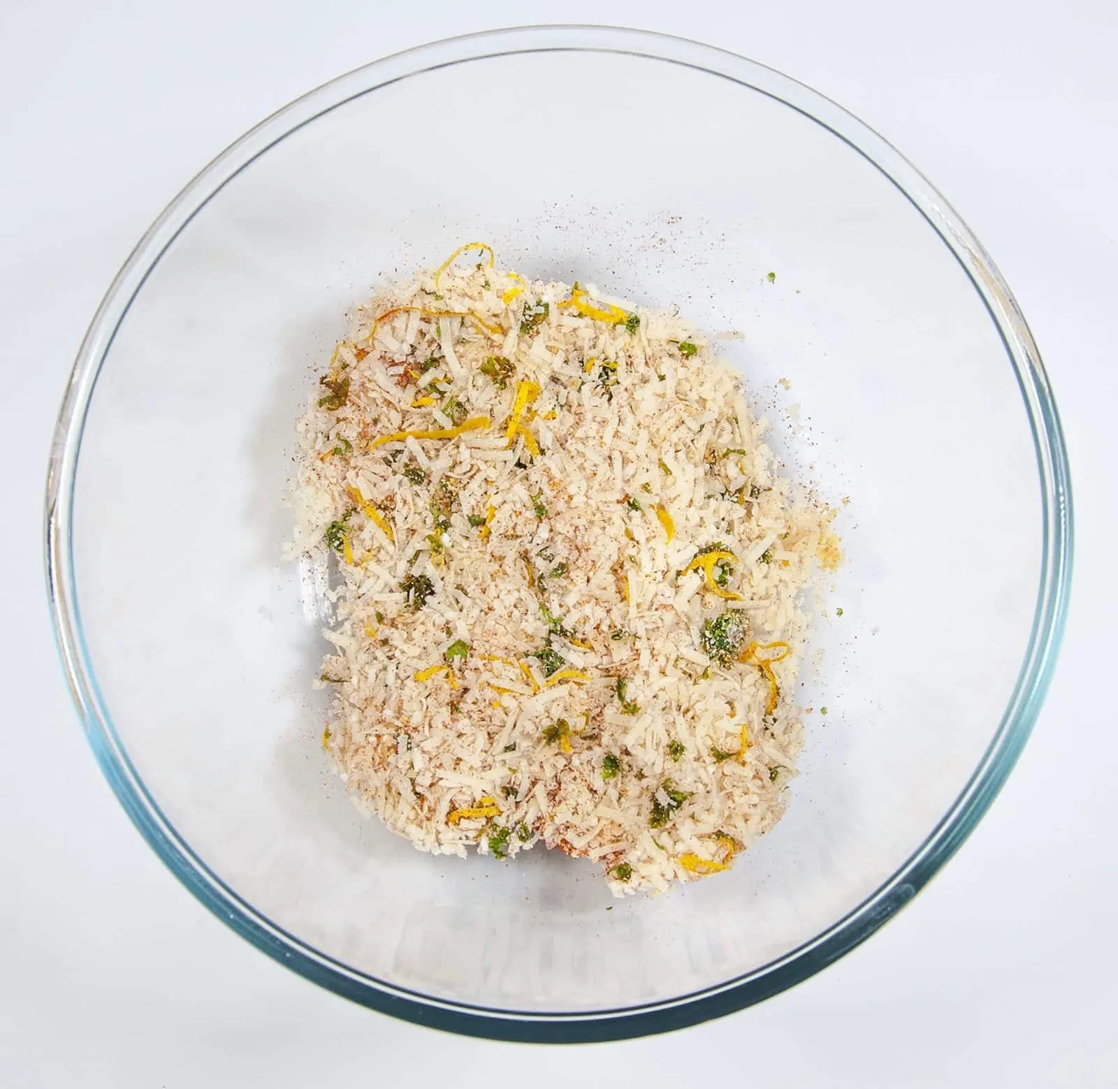 Parmesan & Paprika Haddock Baked in Garlic Butter. Mix the crust ingredients together | https://theyumyumclub.com/2019/04/29/parmesan-paprika-haddock-garlic-butter/