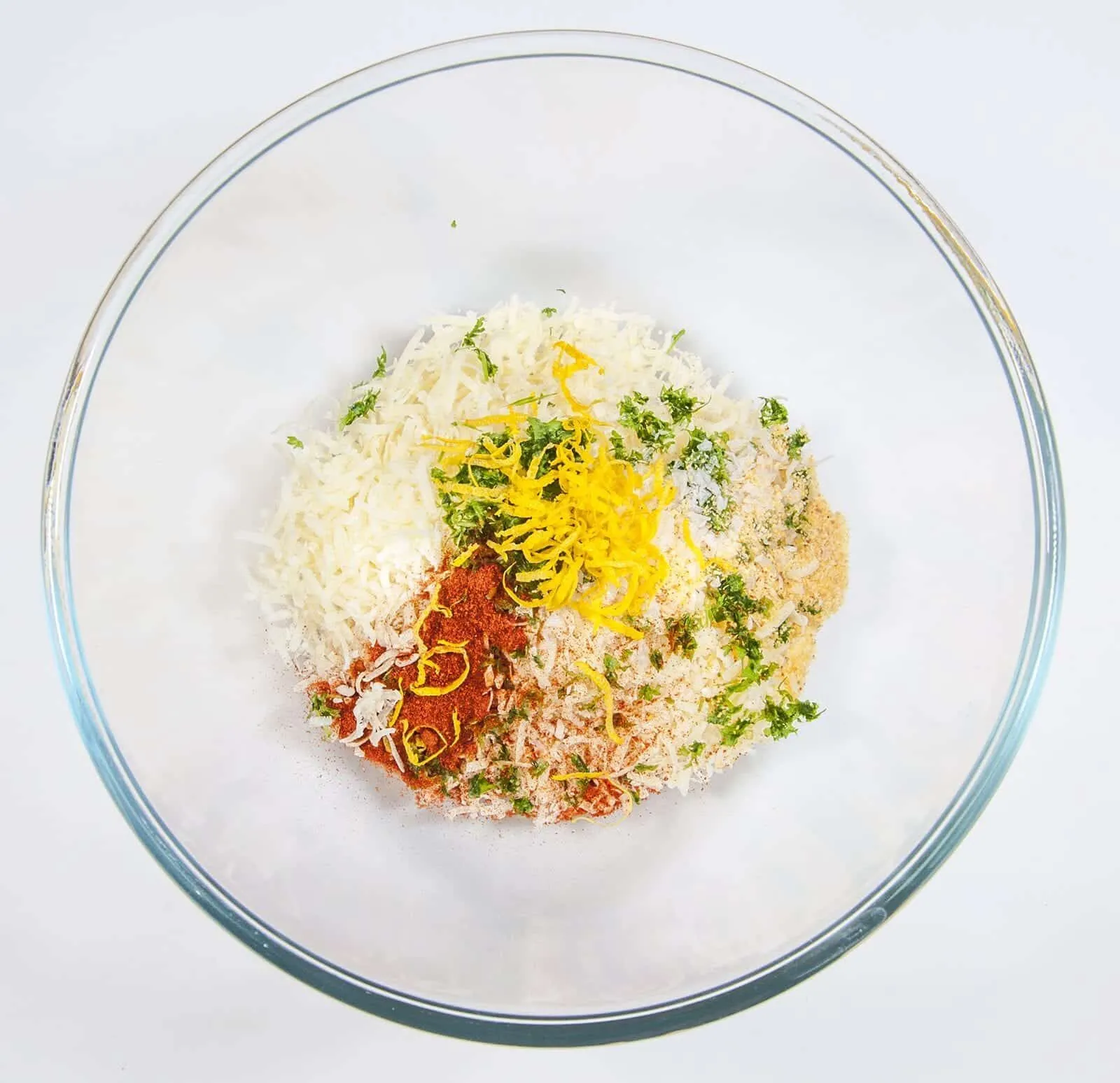 Parmesan & Paprika Haddock Baked in Garlic Butter. Add the crust ingredients to a mixing bowl | https://theyumyumclub.com/2019/04/29/parmesan-paprika-haddock-garlic-butter/