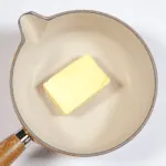 Parmesan & Paprika Haddock Baked in Garlic Butter. Place the butter in a saucepan | https://theyumyumclub.com/2019/04/29/parmesan-paprika-haddock-garlic-butter/