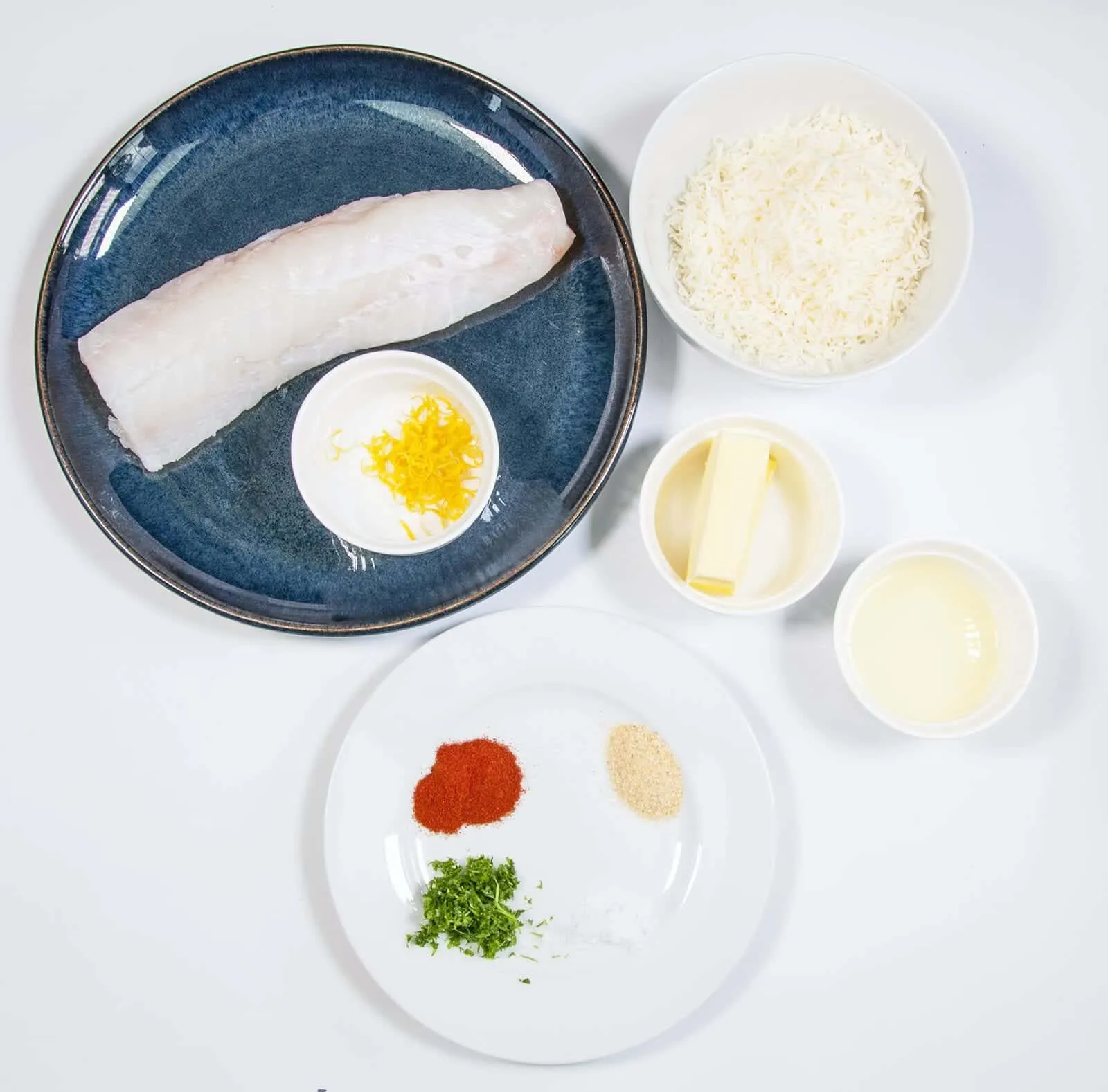 Parmesan & Paprika Haddock Baked in Garlic Butter. Gather the ingredients together | https://theyumyumclub.com/2019/04/29/parmesan-paprika-haddock-garlic-butter/