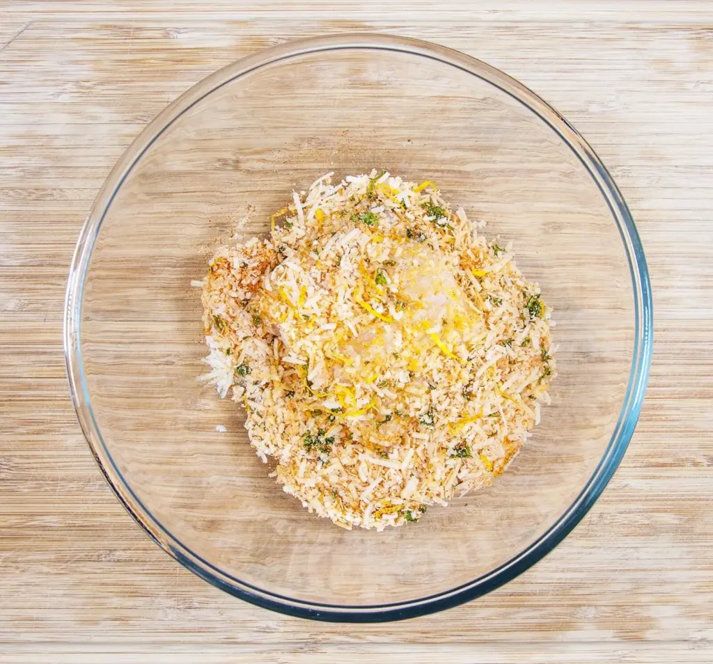 Parmesan & Paprika Haddock Baked in Garlic Butter. Cover the haddock | https://theyumyumclub.com/2019/04/29/parmesan-paprika-haddock-garlic-butter/