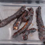 Place the cooked ribs in a roasting tray. Chinese sticky hoisin chilli ribs. Perfect pork spare rib. Yum! Yum! | theyumyumclub.com