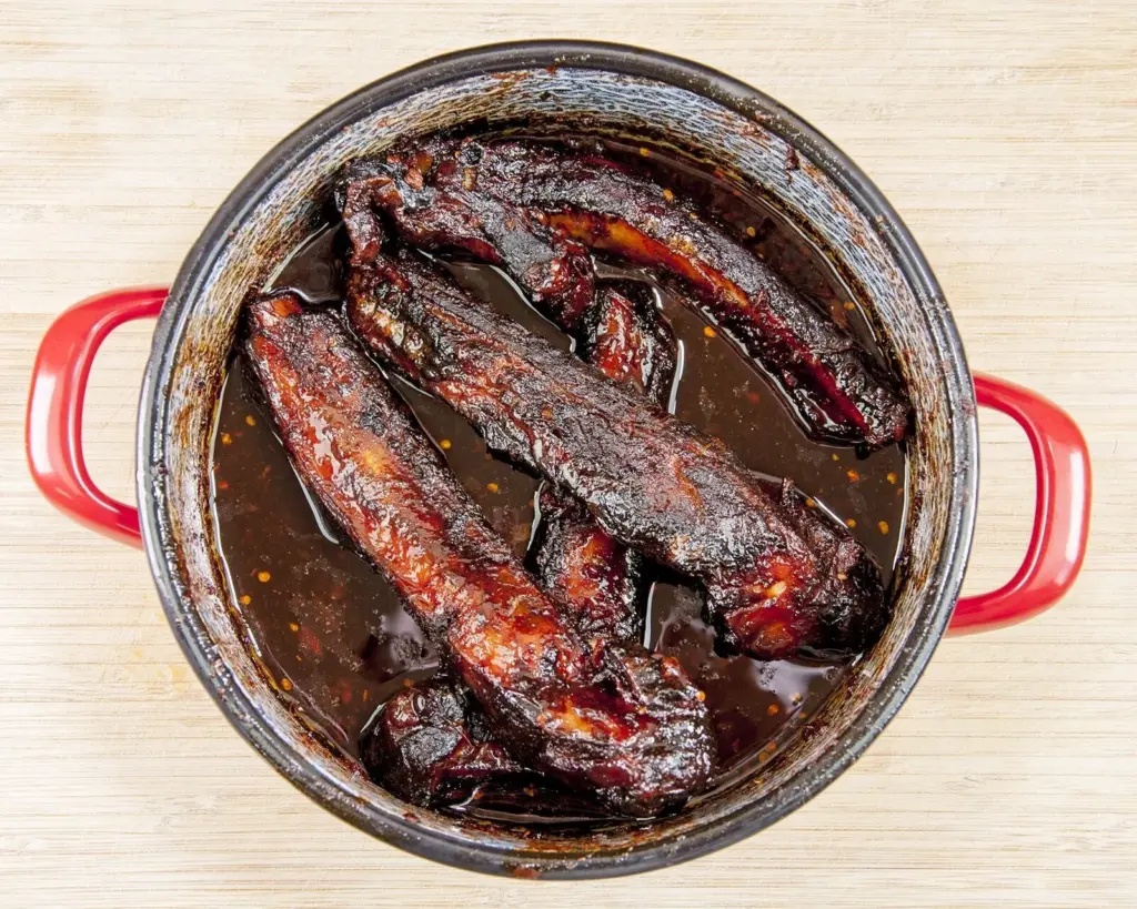 Slow-cook the ribs for 5-6 hours. Chinese sticky hoisin chilli ribs. Perfect pork spare rib. Yum! Yum! | theyumyumclub.com