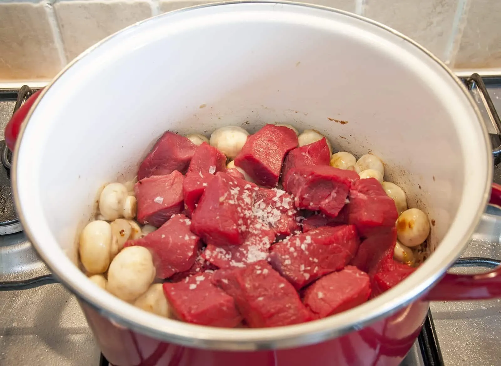 Braised beef rump in red wine. Add the beef steak and season | https://theyumyumclub.com/2019/05/08/braised-beef-rump-red-wine/