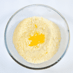 School Pudding Gypsy Tart. Add the egg yolk | https://theyumyumclub.com/2019/05/23/school-pudding-gypsy-tart/