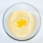 School Pudding Gypsy Tart. Add the egg yolk | https://theyumyumclub.com/2019/05/23/school-pudding-gypsy-tart/