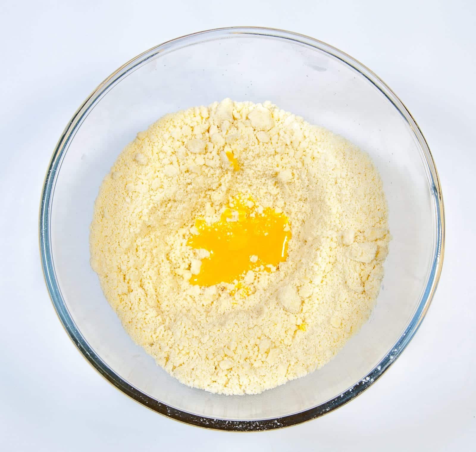 School Pudding Gypsy Tart. Add the egg yolk | https://theyumyumclub.com/2019/05/23/school-pudding-gypsy-tart/