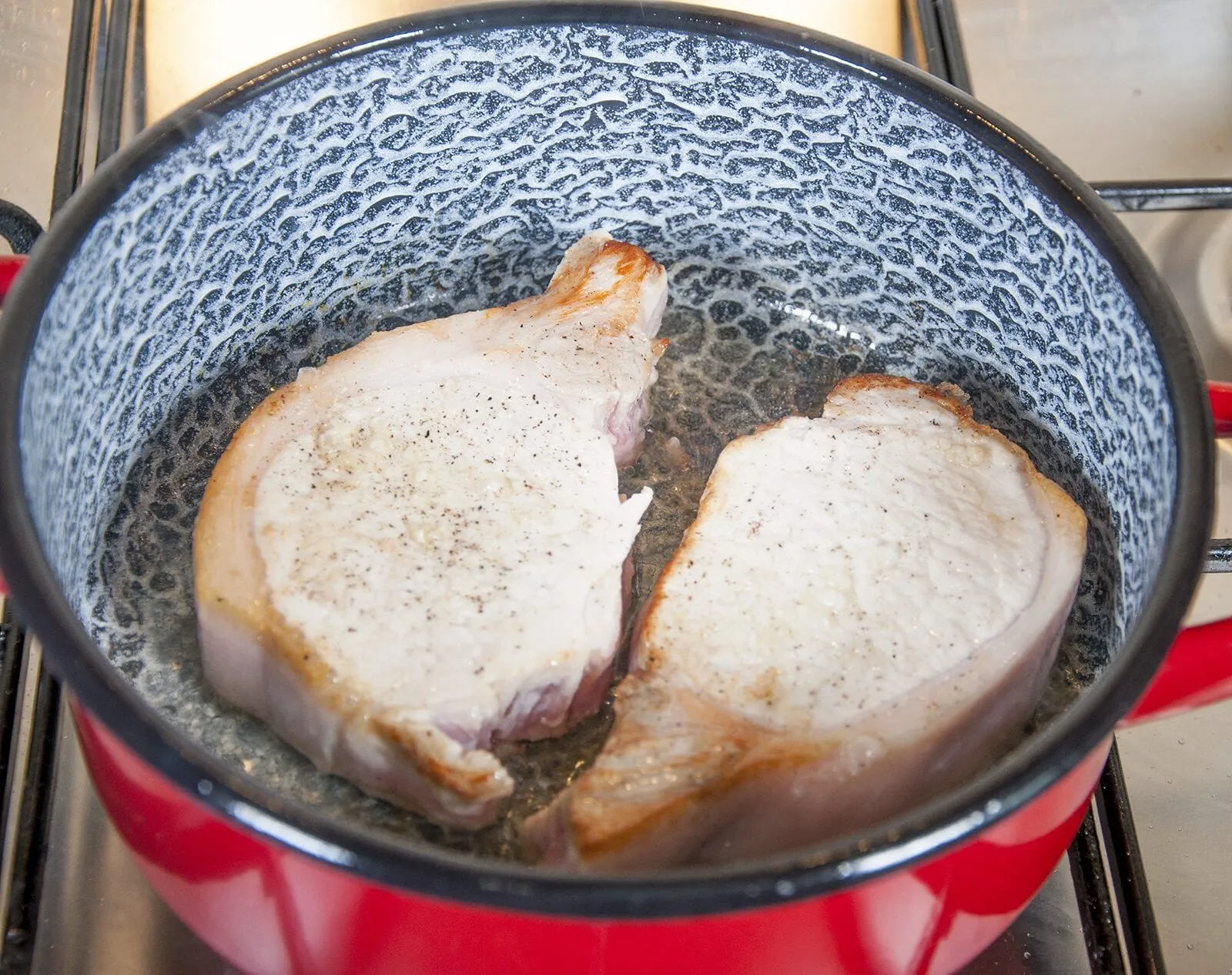 Pork loin in brandy and cream. Brown off the pork loin chops | https://theyumyumclub.com/2019/05/01/pork-loin-brandy-cream/