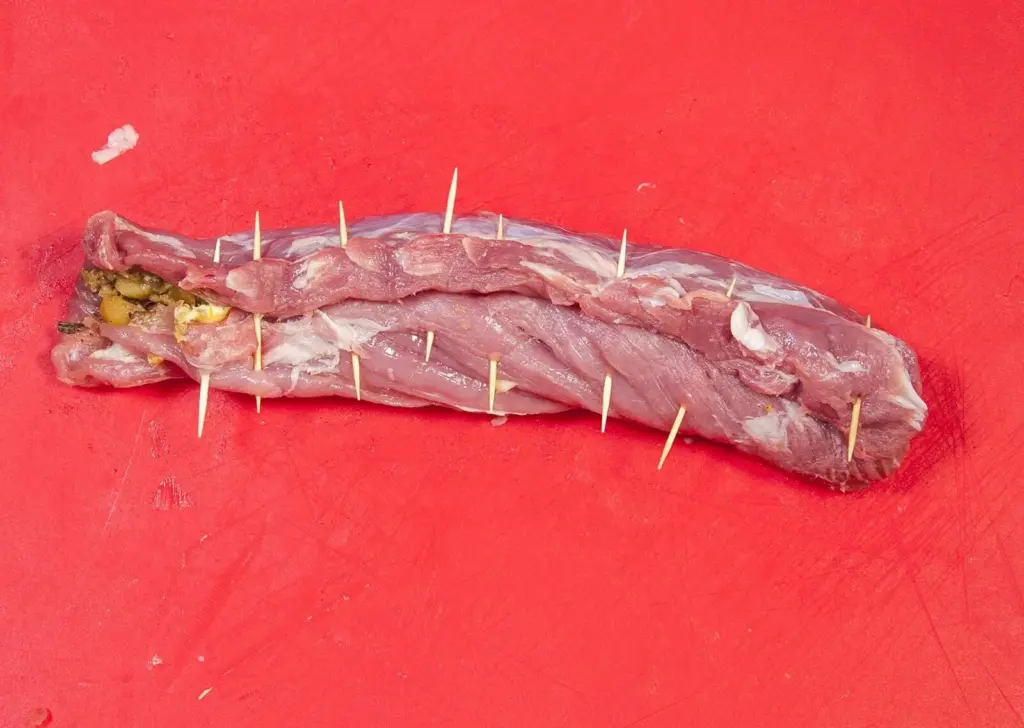 Streaky & apple pork tenderloin. Roll the pork tenderloin | https://theyumyumclub.com/2019/05/19/streaky-apple-pork-tenderloin/