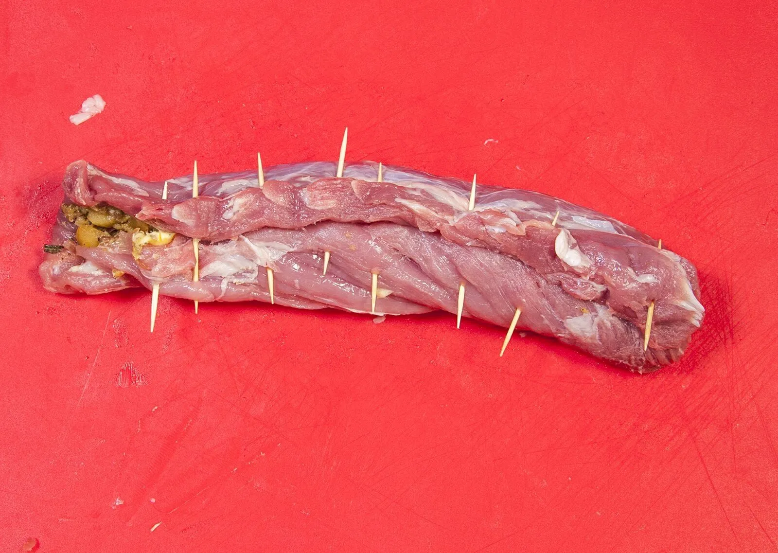 Streaky & apple pork tenderloin. Roll the pork tenderloin | https://theyumyumclub.com/2019/05/19/streaky-apple-pork-tenderloin/