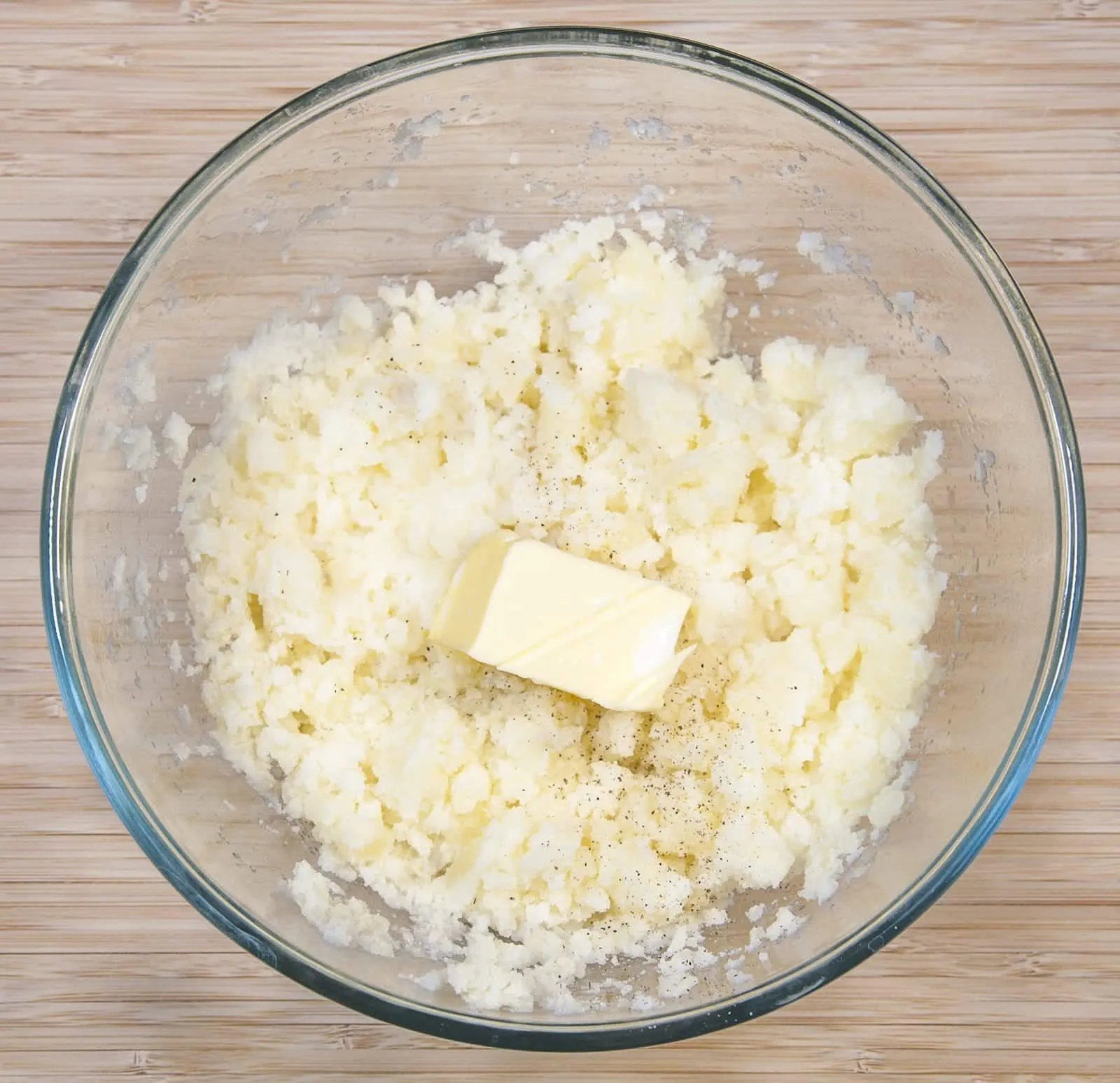 Cheddar topped shepherd's pie. Add the butter and milk to the potatoes | https://theyumyumclub.com/2019/05/16/cheddar-topped-shepherds-pie/