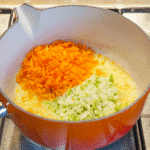 Cheddar topped shepherd's pie. Add the carrots and leeks