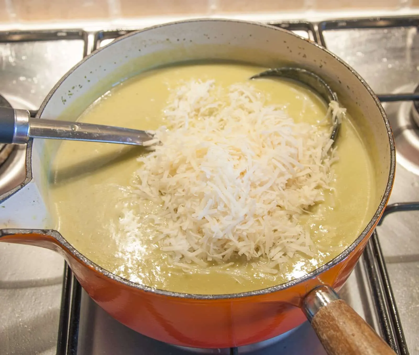 Add the parmesan | https://theyumyumclub.com/2019/06/15/asparagus-soup-lemon-parmesan/