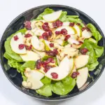 Add the cranberries | https://theyumyumclub.com/2019/06/10/cashew-cranberry-comte-fruit-salad/