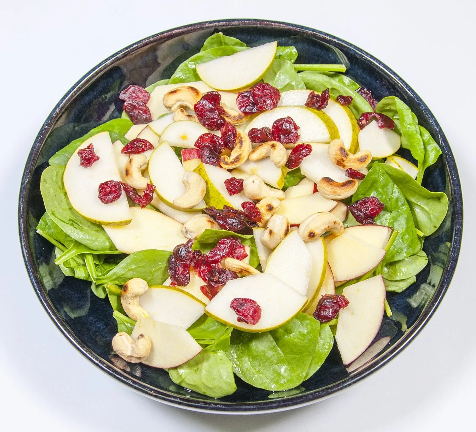 Add the cranberries | https://theyumyumclub.com/2019/06/10/cashew-cranberry-comte-fruit-salad/