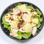 Add the cheese | https://theyumyumclub.com/2019/06/10/cashew-cranberry-comte-fruit-salad/