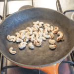 Dry roast the cashews | https://theyumyumclub.com/2019/06/10/cashew-cranberry-comte-fruit-salad/