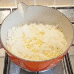 Sweat off the onion and garlic | https://theyumyumclub.com/2019/06/15/asparagus-soup-lemon-parmesan/