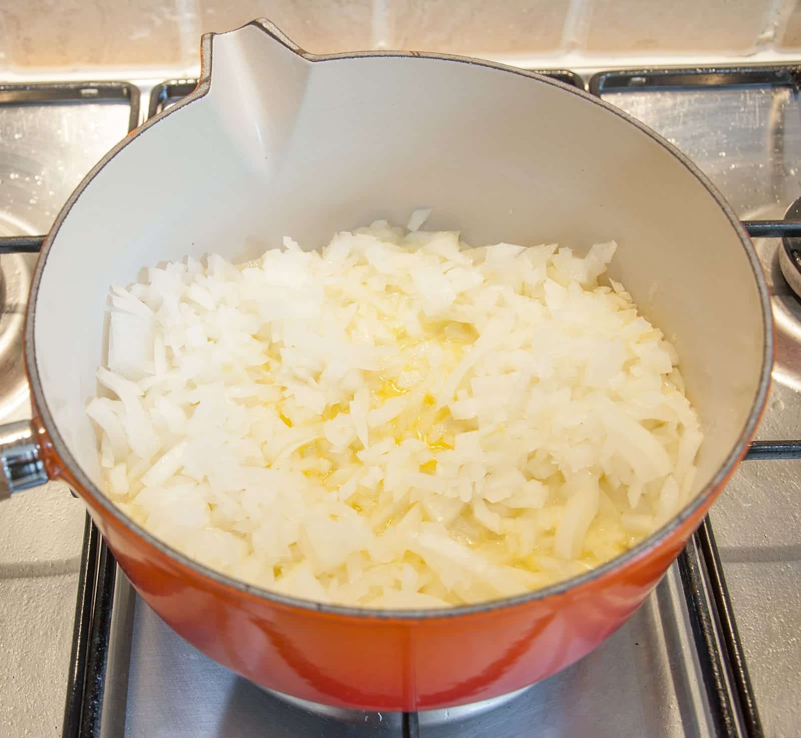 Sweat off the onion and garlic | https://theyumyumclub.com/2019/06/15/asparagus-soup-lemon-parmesan/
