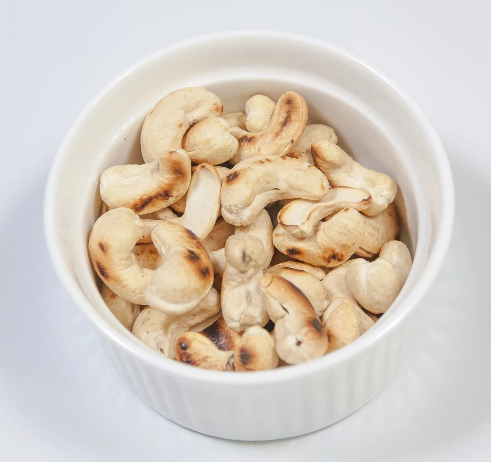 Dry roast the cashews | https://theyumyumclub.com/2019/06/10/cashew-cranberry-comte-fruit-salad/