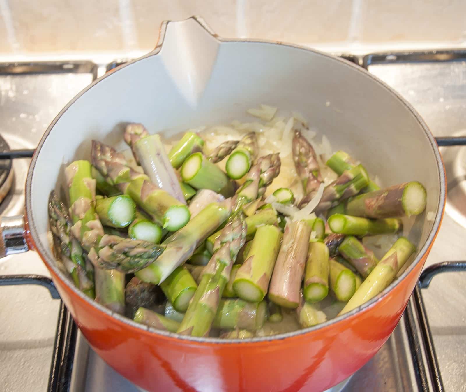 Add the asparagus | https://theyumyumclub.com/2019/06/15/asparagus-soup-lemon-parmesan/