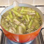 Add the stock | https://theyumyumclub.com/2019/06/15/asparagus-soup-lemon-parmesan/