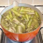 Add the stock | https://theyumyumclub.com/2019/06/15/asparagus-soup-lemon-parmesan/