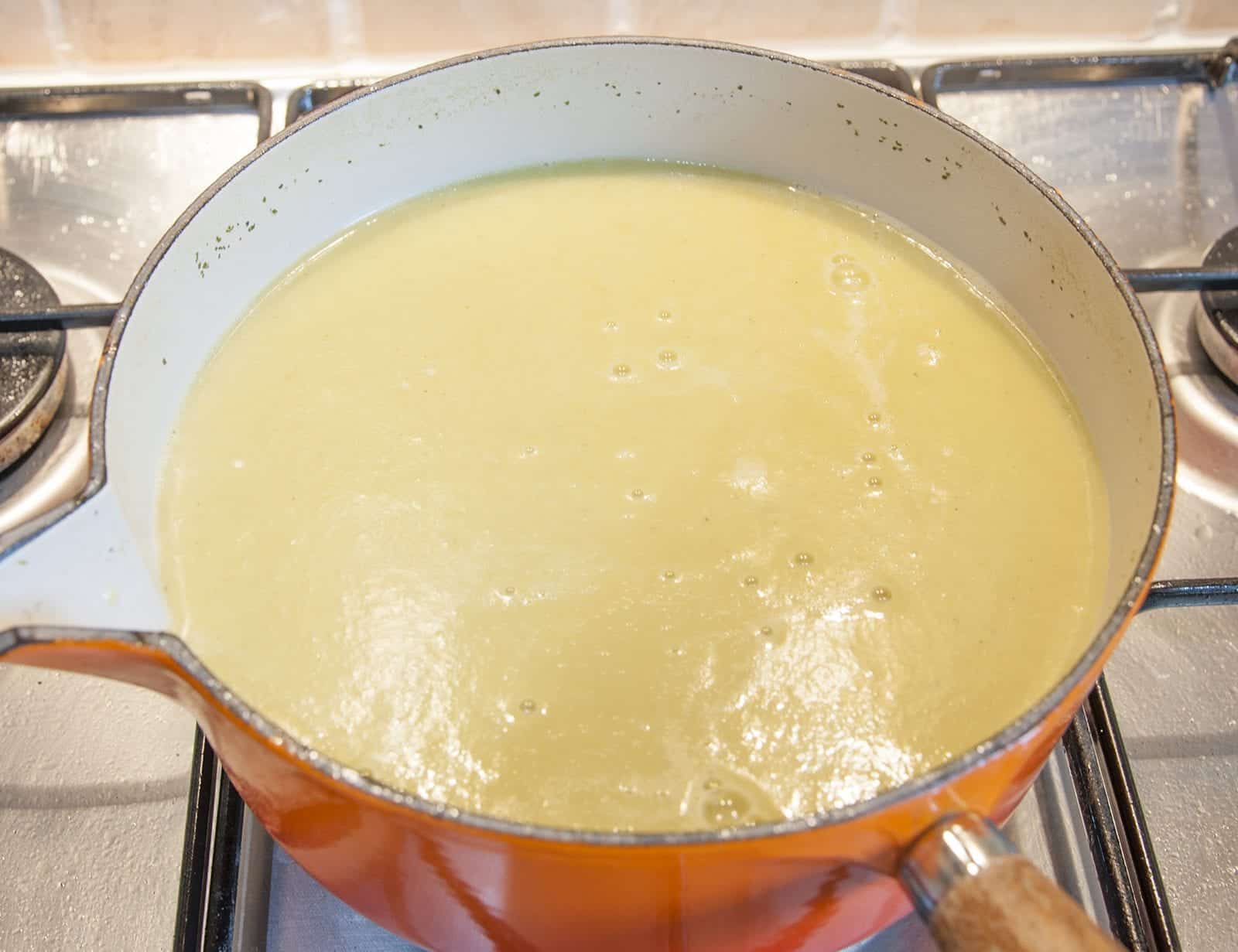 Blitz to a smooth soup | https://theyumyumclub.com/2019/06/15/asparagus-soup-lemon-parmesan/
